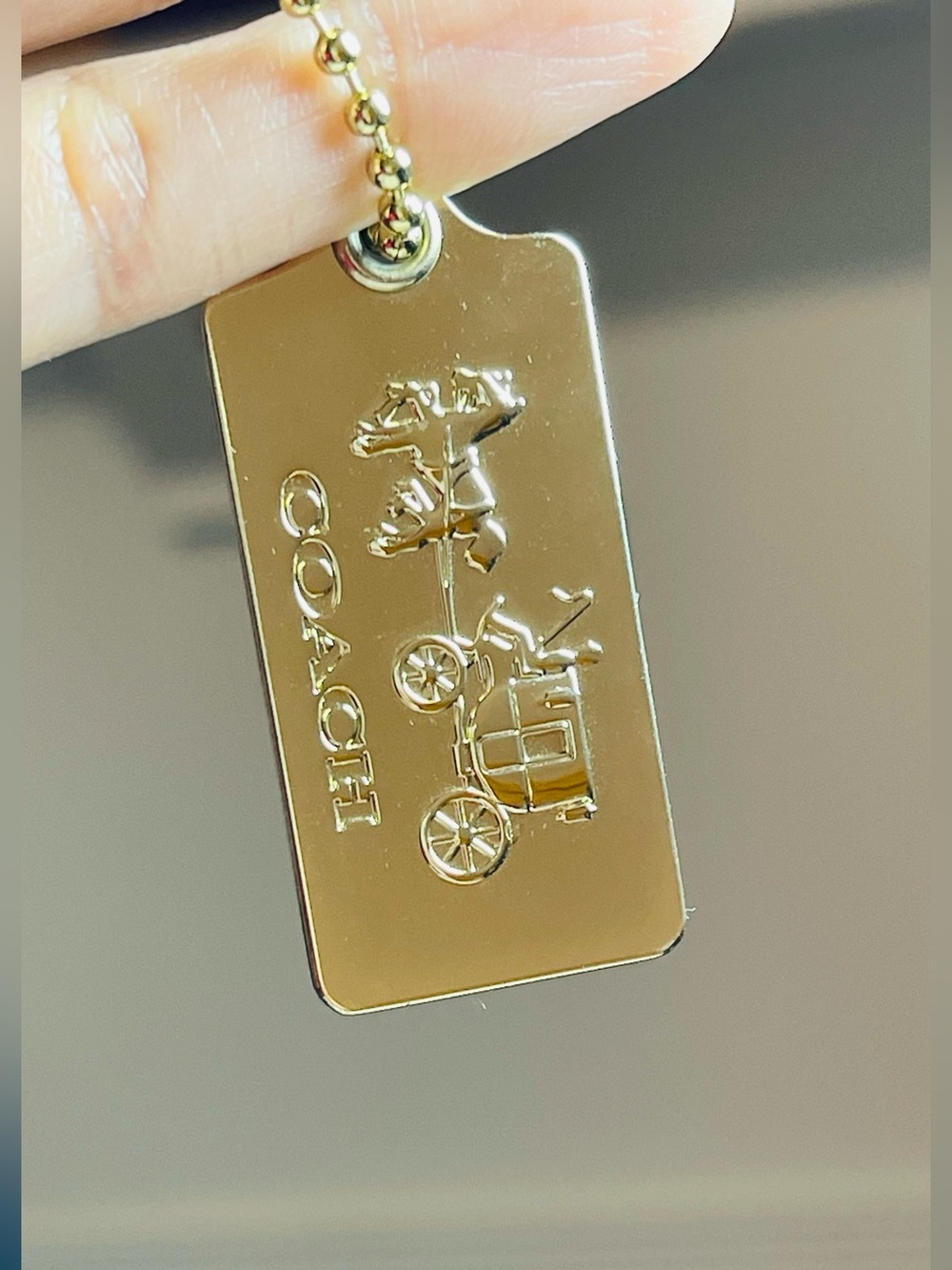 Coach Authentic hangtag gold